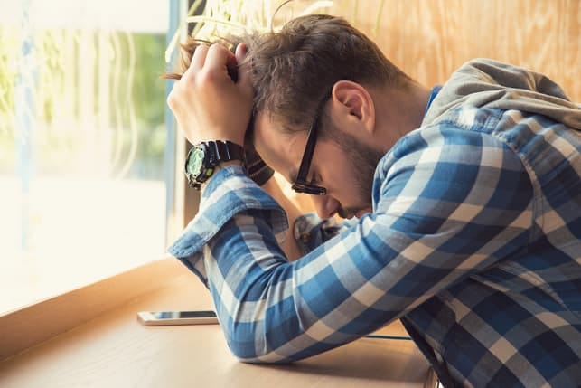 a sad man processing his emotions