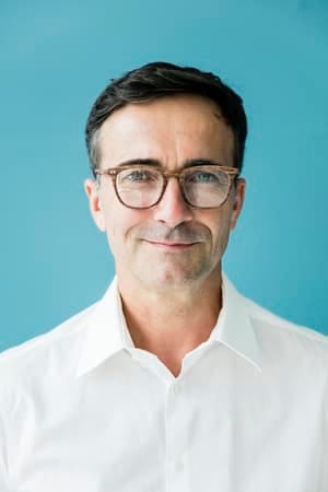 a portrait of a middle-aged man smiling